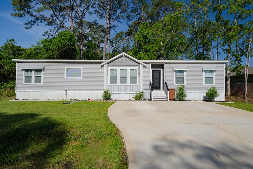 Nestled in a wooded cul-de-sac minutes from Hurlburt AFB and the beach find this pristine 2019 home with no HOA, Oversized driveway perfect for large vehicles and pull behinds. Newly sodded yard has been cleared up to the wetlands and is not in a flood zone.  Lovely front door w/smart lock opens into a spacious floorplan. A large living room overlooks a chef's kitchen complete with stainless steal appliances, Silver Barrel Range Hood and an ample island. Master bedroom has 2 walk in closets. Master bathroom was upgraded to large tile shower, a free standing tub, sitting area and double vanities. 4th bedroom also has a walk in closet. No septic tank; home is on city sewer. Seller pays for warranty and assists w/closing costs. HOME INSPECTION DONE; no cost to Buyer. The Emerald Coast awaits!