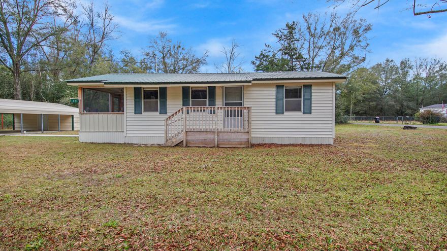 Sweet, simple one-owner home, perfect for someone starting out or for a rental. There are 2 bedrooms and another that could be (and was) used as a 3rd bedroom. Pretty, level corner lot with a carport and small workshop area as well. Screened porch on the east side, perfect for watching the sunrise. Conventional financing or cash only please.