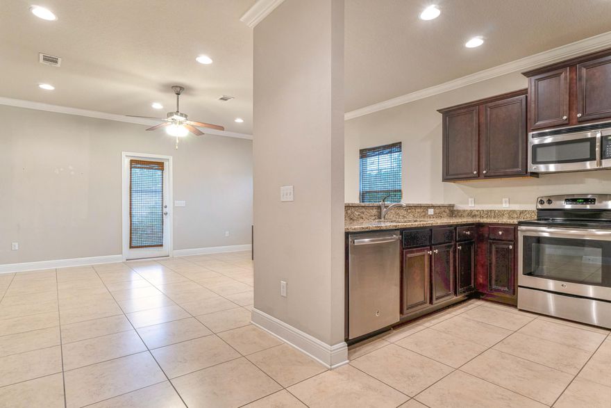 This spacious 3 bedroom 2.5 bath townhouse located just a mile from South Walton's beautiful beaches and scenic Highway 30A and central to shopping and dining of Santa Rosa Beach. Coastal Florida cottage design is beautifully landscaped with tropical Florida foliage. The kitchen is well equipped with stainless steel appliances, wood cabinets with crown molding, granite counter tops, and a breakfast bar. You will love the open floor plan as well as the half bath on the main floor. Upstairs, you will find a large master with a walk-in closet with nice built ins. Two more bedrooms and another full bathroom are a perfect size for family and guests to share. The front loader washer and Dryer come with this home and this is an end unit conveniently located by the mailboxes.