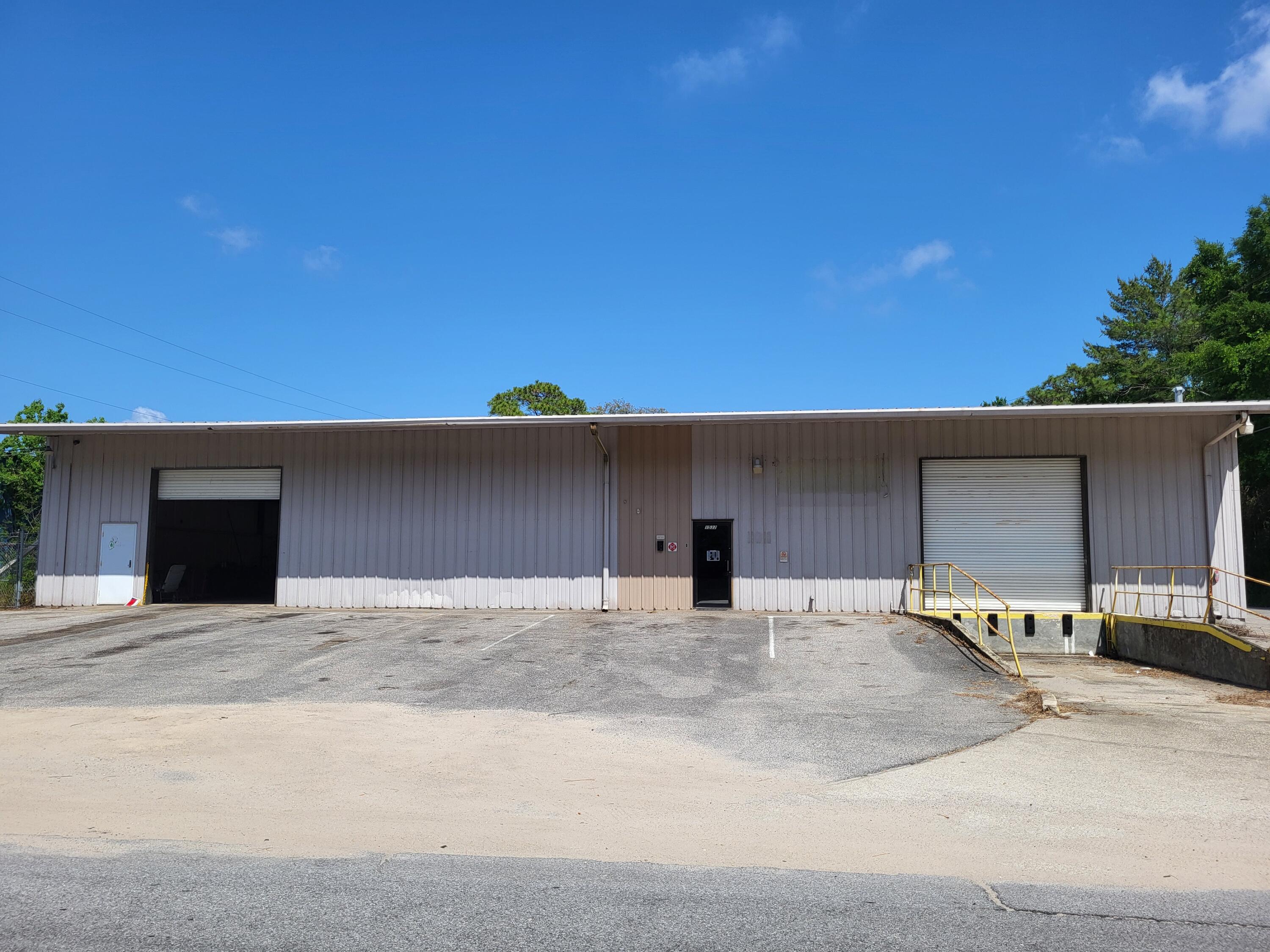 Approx. 1,392 sqft of office, 7,100 sqft of warehouse, 2 roll up doors on the front, 1 on side, 4 in the rear. Rear fenced yard. Zoned Industrial I-1 in Okaloosa County.