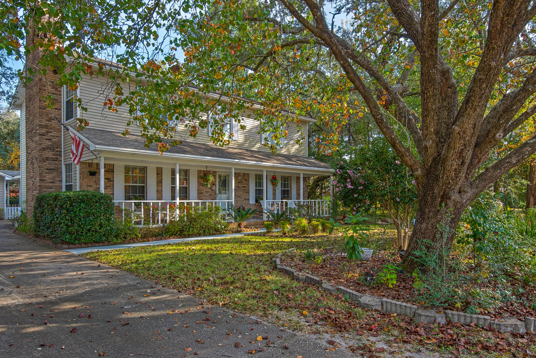 Custom-built Randy Wise home on a .3 acre lot in the highly sought after Woodlands of Bluewater Bay! This 4bd/3ba home has many recent updates to include flooring, bath fixtures, tankless water heater, new doors, fresh paint and more! Upon stepping in from the plantation style front porch, the foyer opens into formal dining and living/office areas and a family room with a wonderful brick-faced gas burning fireplace. The eat-in kitchen has been completely remodeled and features plenty of storage with raised panel oak cabinets, beautiful granite countertops, stainless appliances, new sink and light fixtures. Downstairs you will also find the laundry room, remodeled 1/2 bath, and a fully finished Florida room. The private