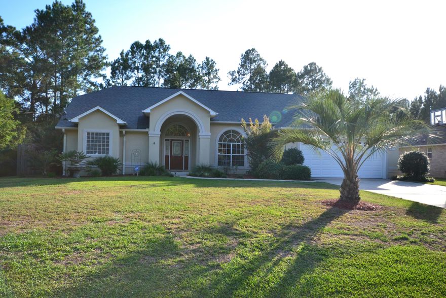 Affordably Priced $210K. Must see to appreciate! VERY convenient to I-10 for commute in any direction. Split floor plan makes Master Suite with tray ceiling your COMFORT ZONE with access to 34'X8' screened patio facing Pool. Master bath has great natural light as it boasts a glass block window over the garden tub with JETS, Separate double sink vanities, a separate shower, and water closet plus huge (10X11) walk-in closet makes this your private get-away. The heart of this home is spacious and welcoming, features its 14' ceiling, gas fire place, plant ledges, and built-in display nooks ALL with an open view of the pool area. The dining area has a large