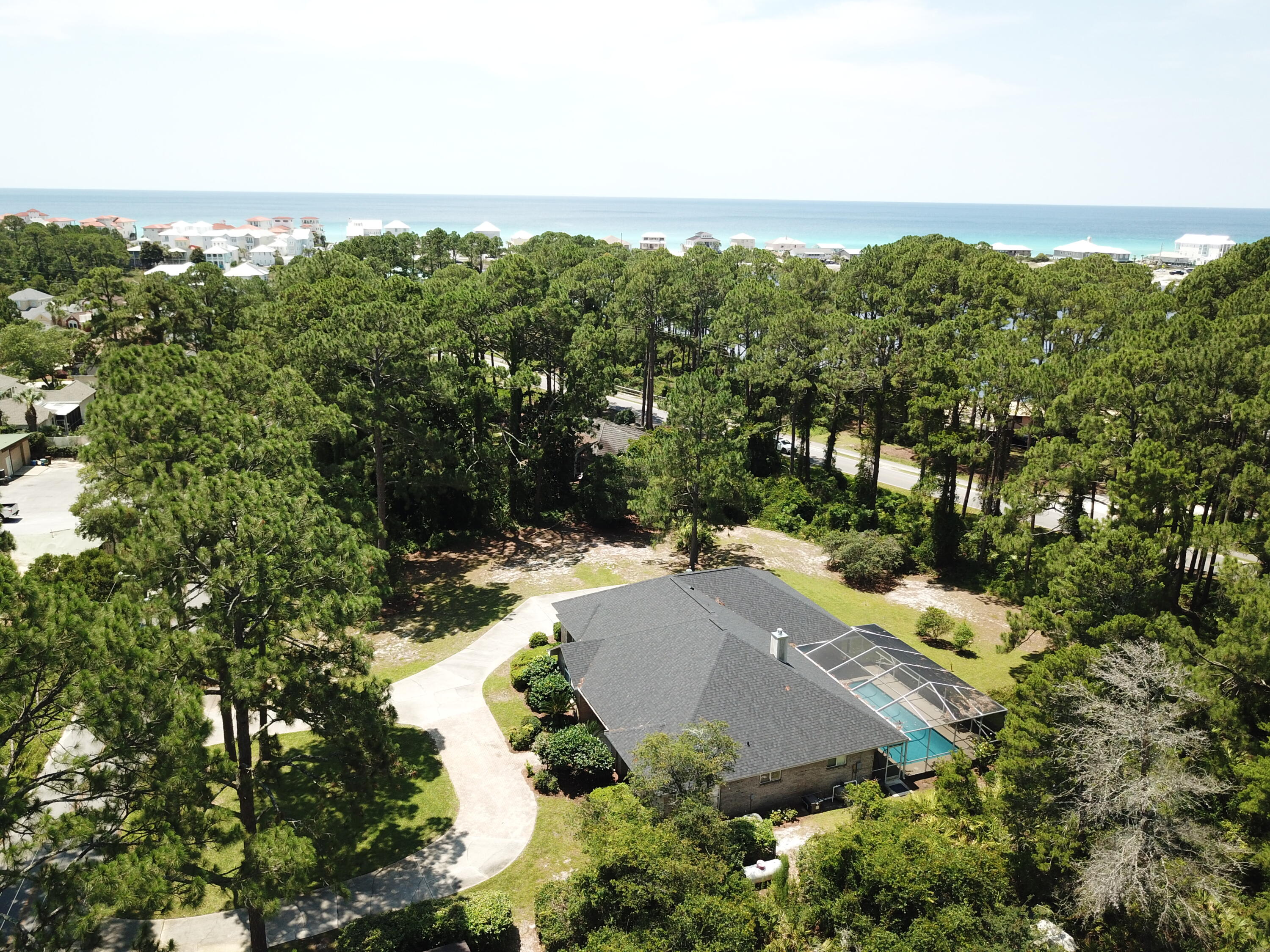 Welcome to your dream coastal retreat in Santa Rosa Beach, Florida! This exquisite real estate gem offers the perfect blend of luxurious living and breathtaking natural beauty. Nestled on a generous .87-acre lot, this 3-bed, 2-bath home spans an impressive 2,530 square feet, ensuring ample space for comfortable living. Situated just 600 steps from the pristine shores of the Gulf of Mexico, this property grants you convenient public access to the stunning beaches Santa Rosa Beach is renowned for. Imagine enjoying sun-kissed days on the sandy shores, indulging in water sports, or simply basking in the tranquility of the ocean waves.  Not only does this coastal oasis boast beach proximity, but it also across the street of the serene Oyster Lake. This natural wonder enhances the ambiance an