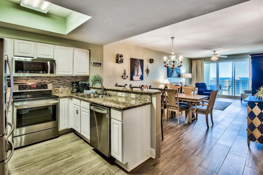 Sweeping gulf view's from this nicely furnished 2 bedroom/2 bath with bunk room on the 15th floor in Ariel Dunes II! 9-foot ceilings featuring a beautiful kitchen with granite counter tops, tile back splash, white cabinets, upgraded stainless LG appliances and under counter LED lighting. Beautiful porcelain plank tile installed in all main living areas with carpet in the bedrooms. New high efficiency heat pump installed July 2022. Enjoy the three large pools (one heated per schedule) totaling approximately 12,000 square feet, as well as convenient deeded access to over 2,000 feet of white sugar sand beach which is less than 200 yards away.