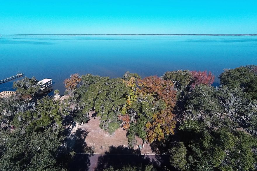 This bayfront lot with sea wall in place offers seclusion within Grayton Bayou. This bay side neighborhood features brick paved streets, a community pool, and natural woodsy atmosphere. Beach access in Grayton Beach is approximately four miles due south. Grayton Bayou truly offers both the best of bay and beach.