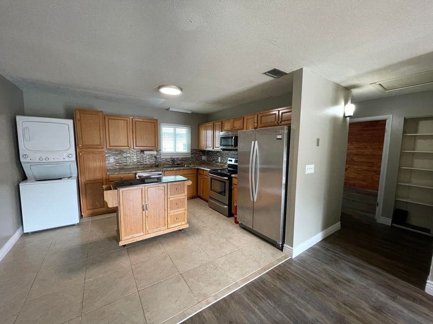 Completely renovated condo in a great locations. Large open kitchen with  stainless steel appliances and elegant glass tile backsplash. All wet areas have tile flooring, New LVP  throughout all other areas. Community pool just a short walk away. Wash and dryer in unit.Water, trash and pest control included.