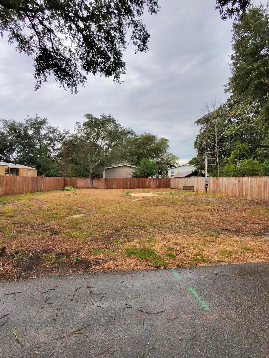 Prime build-ready residential lot just minutes from the beach, military bases, and all the Emerald Coast attractions. This clean, cleared lot has no trees, making construction fast and cost-efficient. The property features residential zoning, an installed septic tank, water, sewer and power connections, and a brand-new fence. Perfect for a new construction home or a manufactured house. A rare opportunity in a high-demand location with endless potential to bring your dream project to life or take this great investment opportunity.