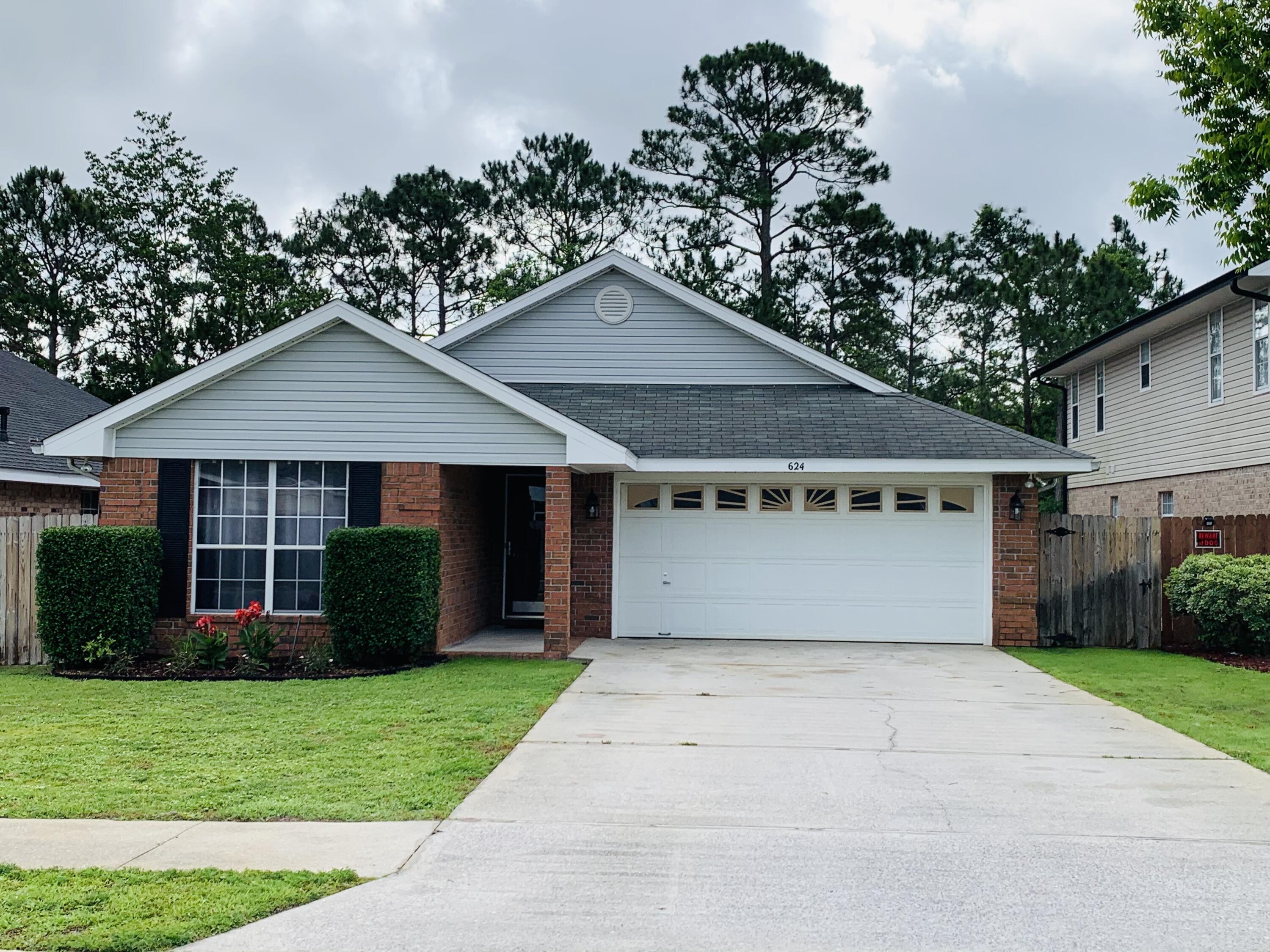 Located at the back gate of Hurlburt Field! ~ 3 bedrooms ~ 2 baths ~ Roof replaced in 2015 ~ Water Heater replaced in 2021 ~ NEW Flooring in bedrooms May 2021 ~ NO Carpet -- ALL Hardwood Laminate or TILE throughout ~ Kitchen complete with Stove, NEW Dishwasher (May 2021), Built in Microwave, & REFRIGERATOR ~ Split Floor plan ~ Washer & Dryer included ~ Sprinkler system with Well ~ Fenced in back yard ~ Home backs up to a conservation easement so no neighbors behind you ~ Call today for your personal tour!