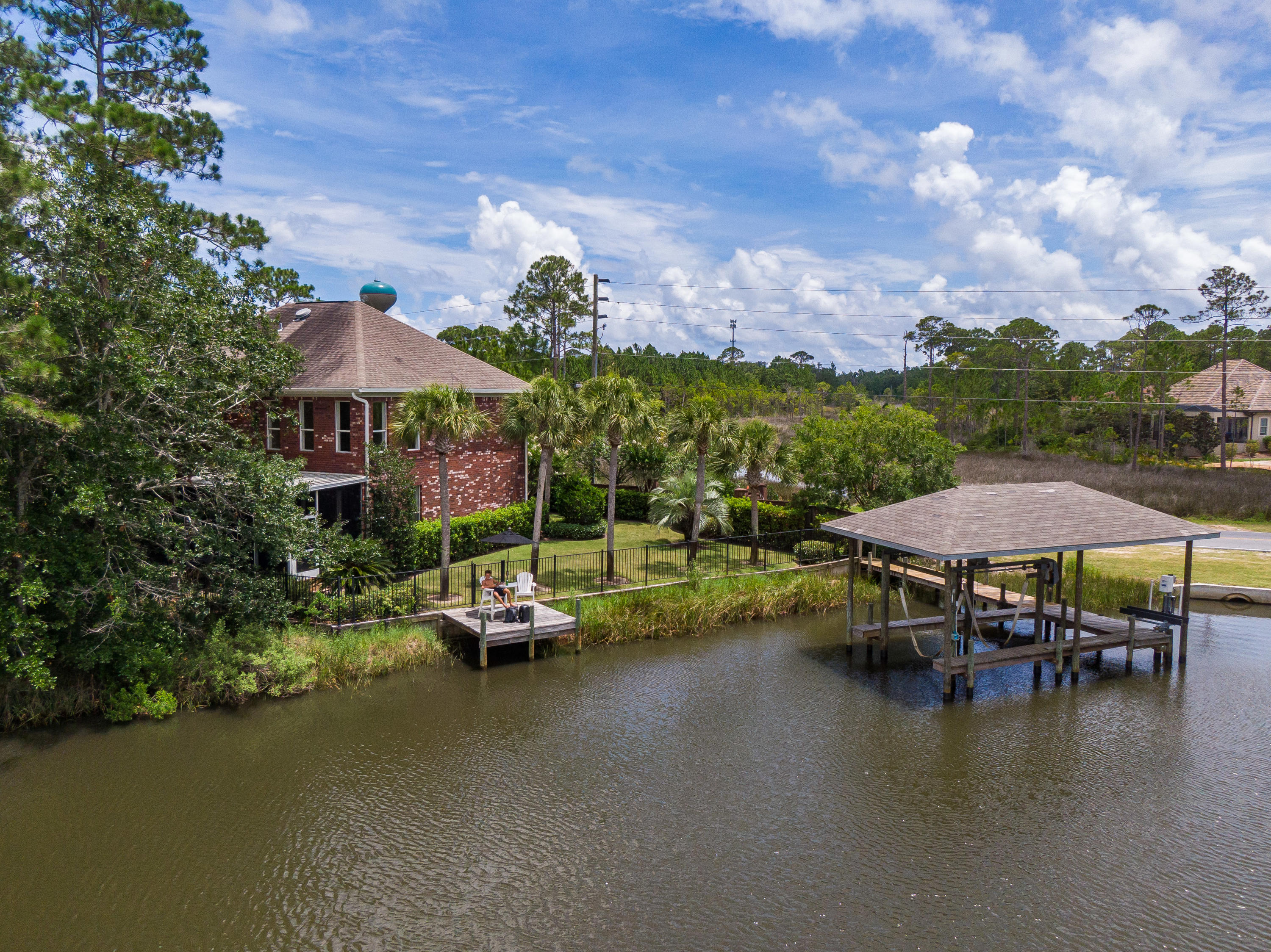 Extraordinary waterfront family estate on deep-water, Buck Bayou, consisting of two homesites with a carriage home and an additional 'cozy' room. This is a must-see property. Property one, 188 Harborview consists of 4200 sq. foot of classic architecture with luxurious interior detail. This expertly appointed home boasts an additional 1700 sq. feet of covered porches with exterior living and outdoor fireplace. Property two, consists of a true Florida bungalow (152 Harborview) with 1662 sq feet to give the estate a total of 5900 sq. feet! These properties can be split up or remain as one homesite. 152 Harborview consists of hardi siding, a metal roof, screened porch and detached garage.
