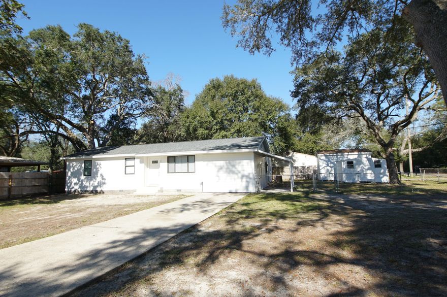 Renovated home very conveniently located in Fort Walton Beach, FL with 1695 square feet, 5 bedrooms, and 2 full baths. This home has a new 2021 roof with a warranty, HVAC 2016, hot water heater 2021, copper wiring, new light fixtures and smoke detectors, new kitchen and baths, and new luxury vinyl plank flooring.  Park your RV in the front yard! No HOA! Also, you this home is perfect for someone who has many vehicles or boats! There is plenty of parking! The kitchen features white quartz countertops, a side by side stainless refrigerator with ice maker, stainless and black dishwasher, built in microwave and stove/oven.