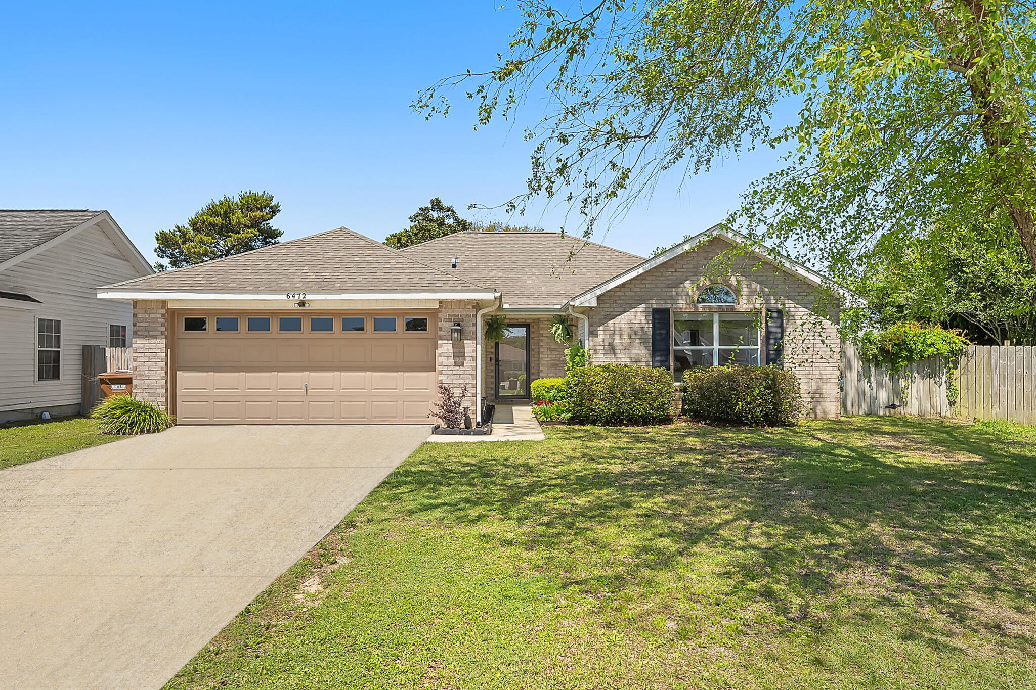 Welcome to this beautifully updated 3-bedroom, 2-bathroom home in the welcoming Lighthouse Pointe community, located at the end of a cul-de-sac! With over 1,550 square feet of living space, this home offers both comfort and style in a family-friendly neighborhood featuring sidewalks, two community parks, and deeded beach access complete with a pier and fishing area. The home offers excellent curb appeal with well-kept landscaping. Step inside to find crisp white paint, warm wood-look flooring, a vaulted ceiling, and well positioned windows that fill the home with natural light. The living room flows seamlessly into the modern kitchen, which boasts granite countertops, stainless steel appliances, a pantry, a breakfast bar, and two designated dining areas! Down the hallway, you'll find all three bedrooms, each with carpeted floors and walk-in closets. The spacious primary suite features a tray ceiling and room for a cozy sitting area. The en suite bathroom offers a double vanity, soaking tub, and separate shower. A second full bathroom with a tub-shower combo serves the additional bedrooms. Access to the backyard is just off the living area - perfectly set up for outdoor entertaining and meals on the patio. The screen door is even equipped with a dog door - ensuring easy outside access for your pets. The laundry room is conveniently located just off the garage entry. Located just off Highway 98, this home offers easy commuting and is perfectly situated for enjoying everything the area has to offer. Don't miss your chance to own this well maintained home in a charming coastal community with fabulous amenities!