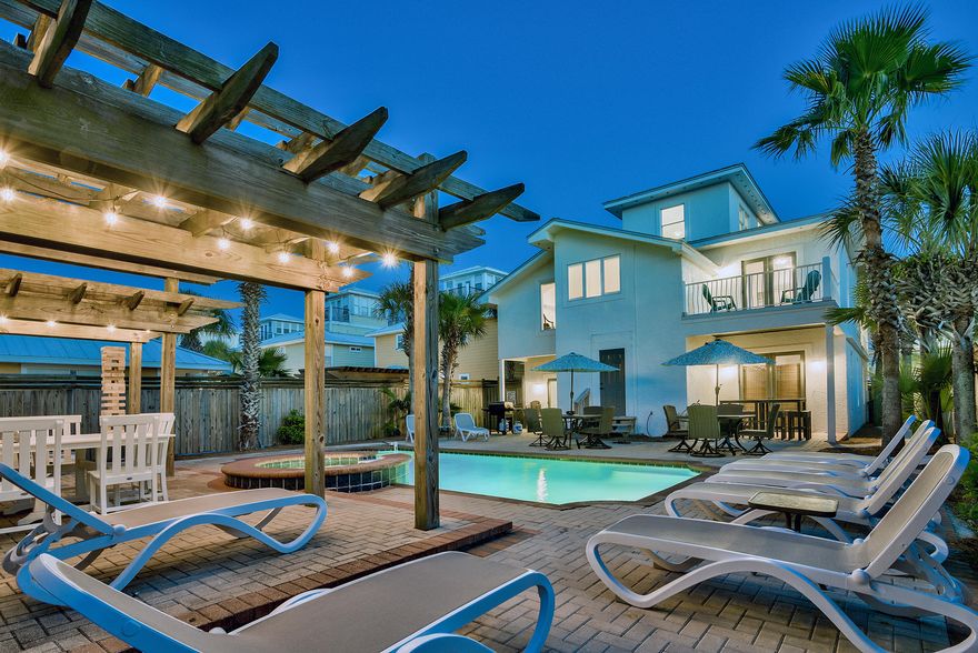 RENTAL MACHINE and projected to produce an 18% cash return in 2021. This beach house is just steps away from the sugar white sand beaches and the pristine emerald waters that have made Destin famous. The home is furnished to maximize rentals and is capable of producing over $260,000 in 2021 per the current manager.  Wrap-around balconies offer ample outdoor space to listen to the ocean waves and take in the views. The spacious backyard has a resort style pool featuring a waterfall jacuzzi and three tier pergola.  For rainy days or late night fun, the massive game room is equipped with a pool table and wet bar and the home is less than half a mile to Destin's best shopping, dining and entertainment.