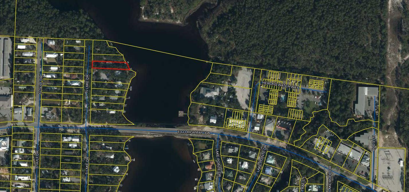 Waterfront opportunity on eastern lake. Experience the rare opportunity of owning A waterfront property just off 30 A, overlooking the serene and picturesque Eastern Lake. Nestled amidst a lush landscape of mature native oak trees, this enchanting lot awaits your dream home. Tucked away at the end of a tranquil lane, the high elevation of this property offers the potential for breathtaking views of the Gulf of Mexico. Adding to the allure, a newly constructed pier and boat lift are already in place, providing easy access for boating or paddle boarding adventures directly to the gulf. Unlike many lakes on 30A Eastern Lake allows motorized boats, allowing you to explore its water at your leisure. Whether you choose to sit on your private peer or set sail to the gulf, magnificent sunsets await you. As you plan your new home, take advantage of the two-bedroom cottage already on the property offering a cozy retreat during the design phase. Emphasizing the incredible value, it is evident that the true treasure lies within the exceptional lot beckoning you to seize this opportunity.