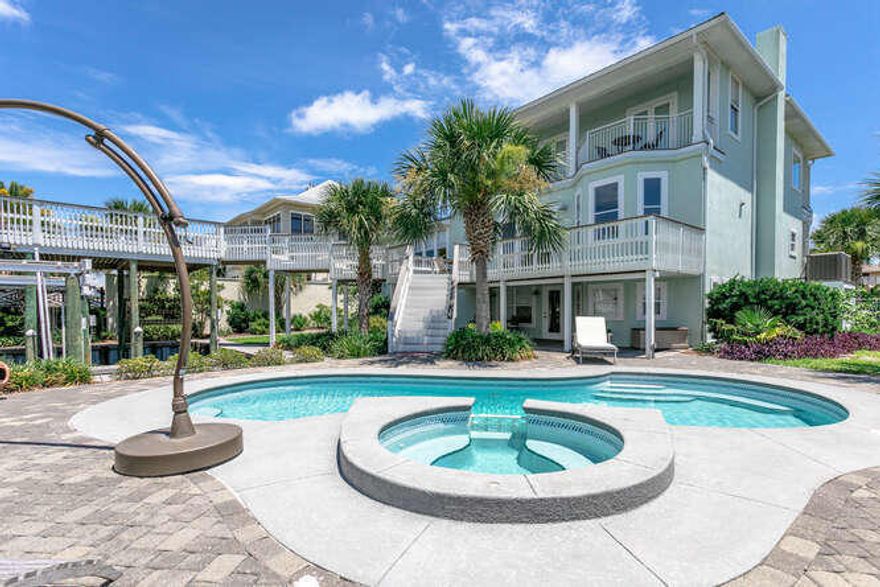 Anglers Avenue is a newly renovated boaters paradise and just 2 blocks from the beaches of Holiday Isle.Anglers Avenue boasts 90ft of water frontage on the canal with two 40ft inland boat slips one is covered. There is a 20,000lb lift in one and a pontoon lift in the covered slip. The inground pool and entertainment area complete the back yard. Enjoy harbor and sunset view from the second floor deck extending over the covered boat slip. The master bedroom encompasses the entire 3rd floor offering sweeping views of the harbor and canals. The 2nd floor offers a living room, a kitchen, and 2 bedrooms. The lower floor has two bedrooms another living room opening up to the pool area and harbor life.  Great place to relax after boating and fishing.  Bring your boat and enjoy the easy ride out