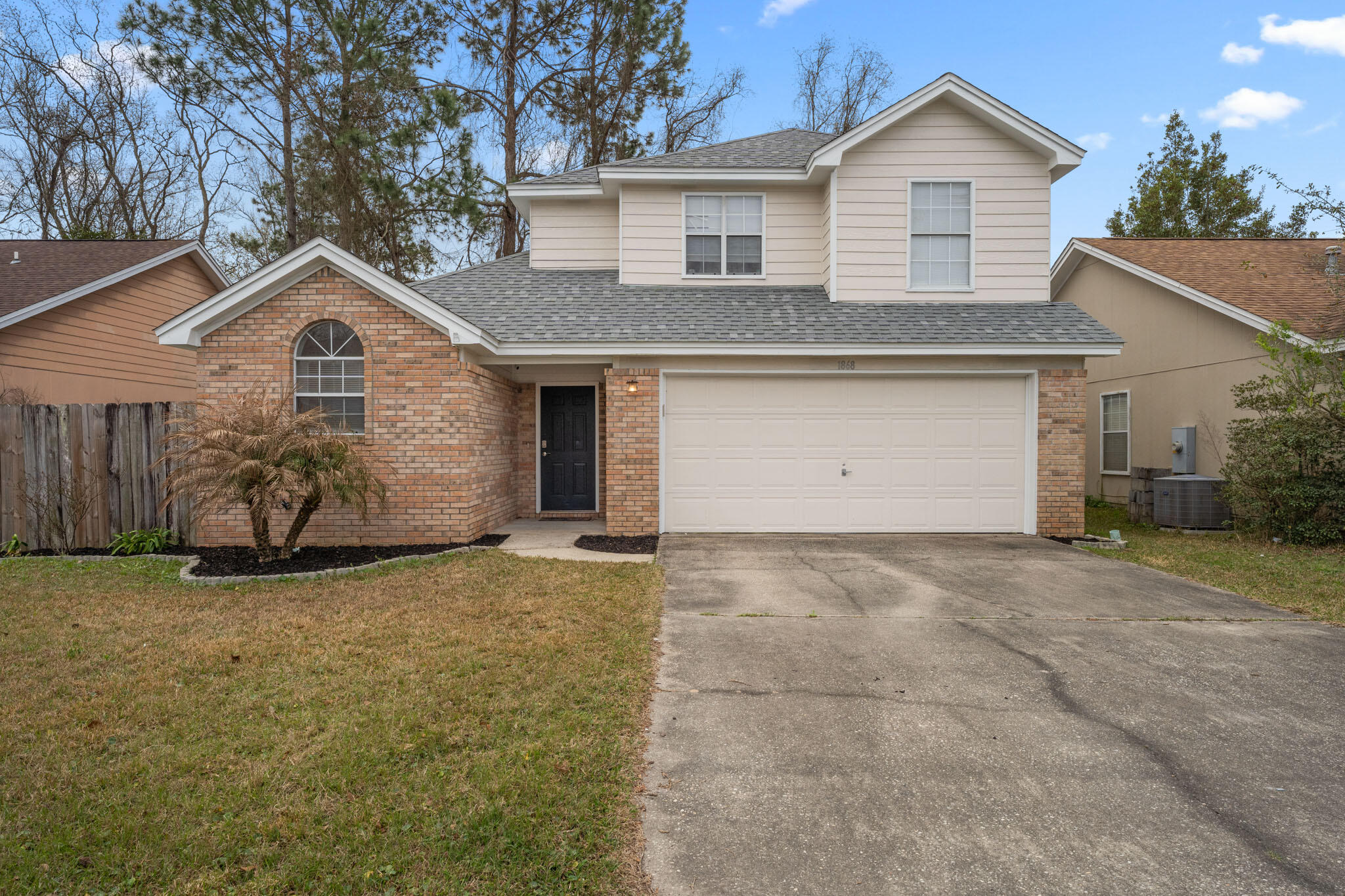 Charming 3 bedroom 2.5 bath home in Fort Walton Beach. This conveniently located home features an open floor plan with cathedral ceilings, fresh paint, a fenced in backyard, tons of natural light, and a first-floor master bedroom. The master bathroom features a double vanity with plenty of storage. There is a half bathroom downstairs for your guests. Upstairs you will find the additional two spacious bedrooms and a full bathroom.