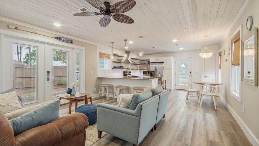 This darling Inlet Beach Heights ranch style beach cottage is ready for its new owner! A great investment for a Vacation rental, primary, or secondary home being only .3 miles or three blocks from beach access 95 on the very west end of PCB! Conveniently only three miles from all that Inlet Beach, Rosemary Beach, and 30A have to offer. This corner lot has great curb appeal with new landscaping and stained wood decking that wraps this home from front to back. Enjoy the spacious 200 sqft screened porch with a book or with friends and family. Head out the french doors to the private back yard and deck to grill dinner and enjoy the sunset colored skyline! This home offers an abundance of natural lighting throughout!