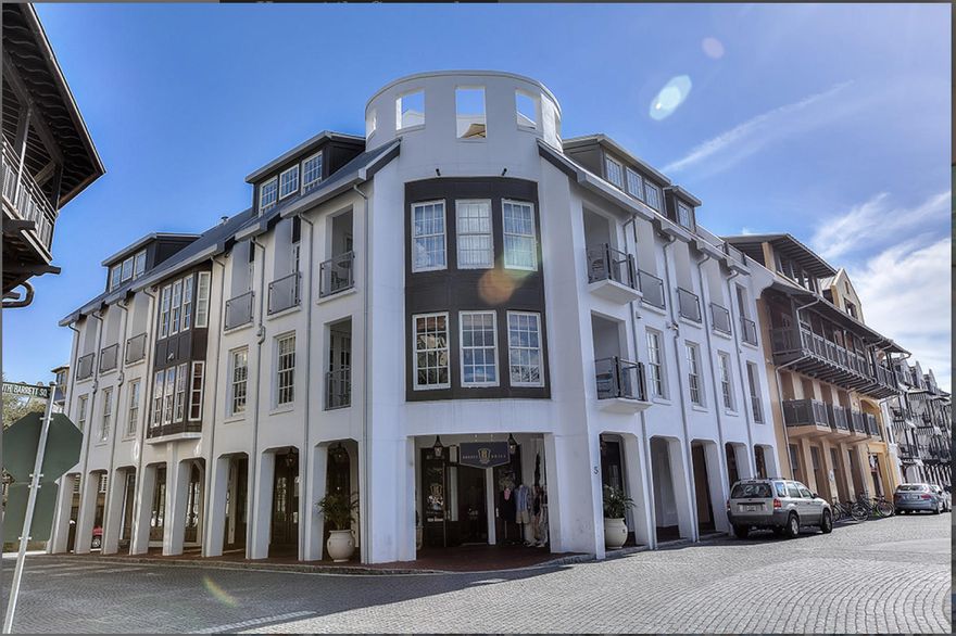 BEST PRICE CONDO on the GULF SIDE in ROSEMARY BEACH. THE CITY MEETS THE BEACH in this CORNER 2nd floor unit in the SAVANNAH. ONLY 500 FEET to the POWDER WHITE SAND and gorgeous PANORAMIC VIEWS OF THE HEART OF ROSEMARY. Recently renovated, this unit is so light and bright with wall of bay windows in main living area with balcony overlooking the Town Hall and green. SOLD FULLY FURNISHED with beautiful designer furnishings making this one RENTAL READY with great rental numbers for 2015 and projections of $100K for 2016. With sleeping capacity for 10 this is a favorite for many families. The unit features 2 large living areas separated by a large barn door, open modern kitchen with Viking appliances, granite counter tops and open shelving.