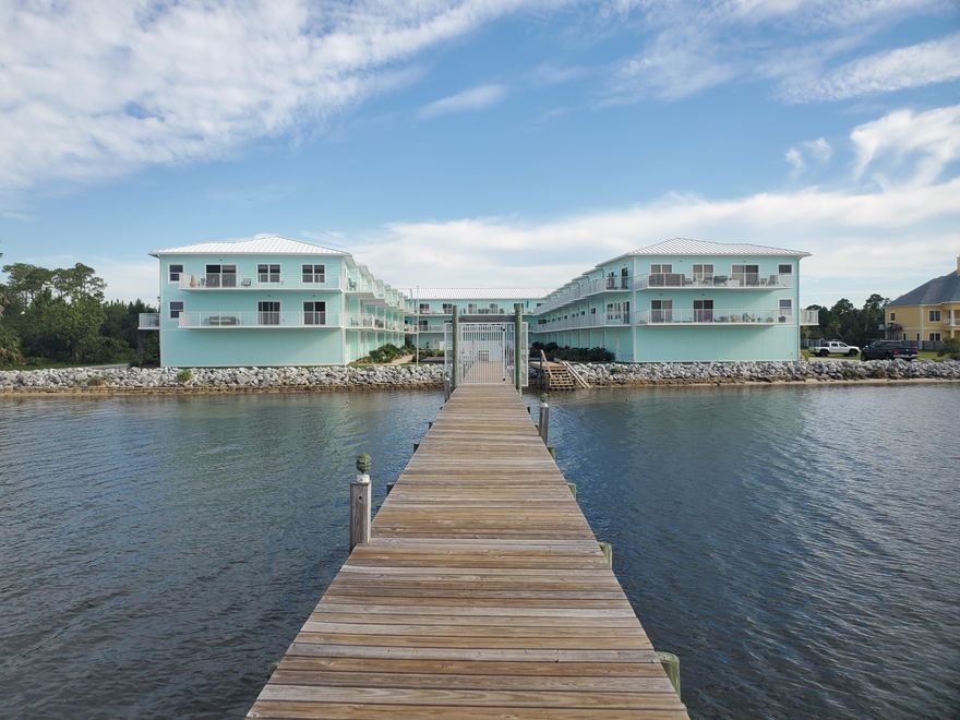 Enjoy the wonderful views of the sound and amazing sunsets from this beautiful townhouse and community. The property has so much to offer including multiple balconies, open kitchen & living room, and a large, multi-car garage. The master bedroom suite has its own balcony, along with a walk-in closet and a master bathroom that includes a double vanity, garden tub and separate shower. The exterior features concrete construction and a raised seam metal roof. It's a close community where everyone shares the backyard amenities including a community pool, sitting area, and access to the boat dock and water. The property is just a short drive away from Gulf Breeze proper, Pensacola Beach and downtown Pensacola.