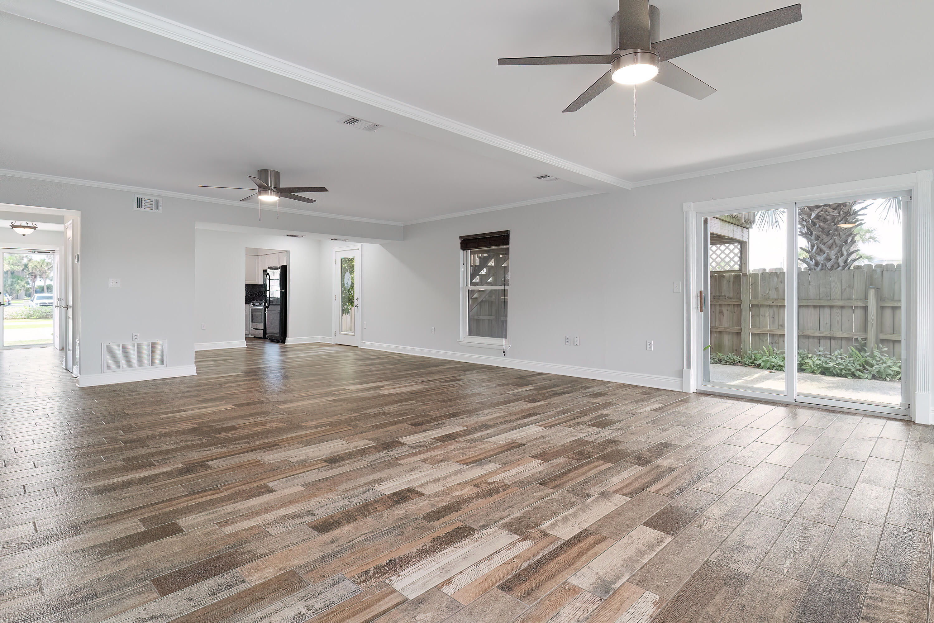 PRICE CHANGE - SHORT-TERM RENTALS - NO HOAFantastic location! 2200sqft. END UNIT is right across from the Emerald View Public Beach Access and adjacent to the Okaloosa Island Boat Basin. Inside, the main area on the ground floor includes a cozy gas fireplace, stylish wood plank flooring, a guest bathroom, and several exterior doors that open up to a spacious patio/deck perfect for entertaining, complete with an outdoor shower. The kitchen has beautiful granite countertops, a gas stove, and a pantry.Upstairs, you'll discover the master suite, which includes a bonus room that leads to a lovely wrap-around deck. There's also another bedroom conveniently located adjacent to the staircase.Once again you cannot beat this location with NO HOA!