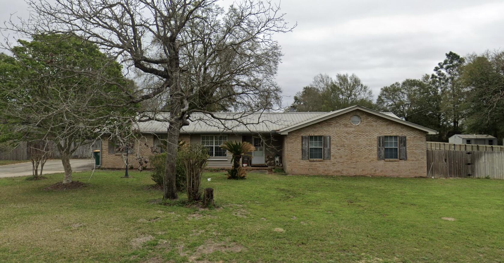 Awesome Crestview home situated on over half an acre that features a big shop building, RV electrical hookup, wood burning stove (fireplace), and an open floorplan! Endless possibilities to make this house your next home! Double gate for drive back back yard!