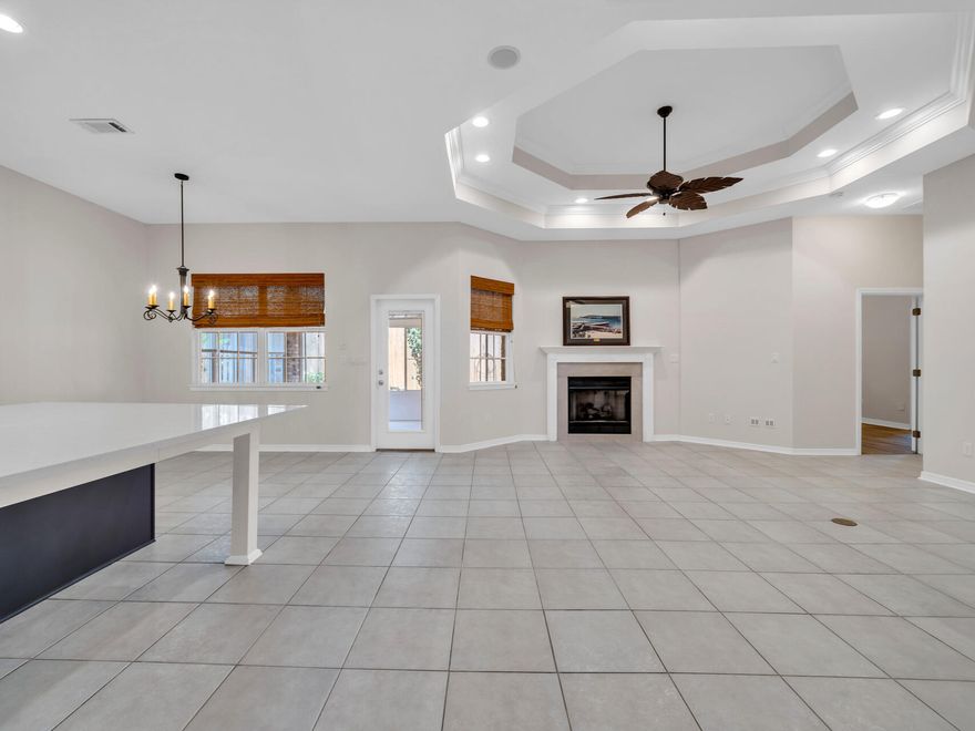 3 BEDROOMS + OFFICE + 3 FULL BATHROOMS close to hospital, Lowes, Sam's Club, Aldi , both bases & schools!  WANT A LARGE, PRIVATE, SEPARATE AREA/ BEDROOM FOR MOM, DAD OR OLDER KIDS? YOU'VE FOUND IT.  TIRED OF YARD WORK? LOOK NO MORE. An oversized 2nd bedroom w/kitchenette, new roof, New gas HWH, large beautiful kitchen, small, low maintenance yard & community pool close by set this custom Home apart.  Flowing effortlessly into the casual dining area & spacious living rm w/12 ft tray ceiling & gas fireplace, the NEW, giant, 42sf Quartz kitchen island takes center stage & will be the gathering place for all! A separate formal dining rm w/11 ft tray ceiling sets the stage for intimate gatherings & celebrations.  Work privately from home from the separate office w/big closet & French doors. The large master bedroom w/11 ft tray ceiling is located away from the other bedrooms and adjoins the sprawling master bath w/luxurious custom tiled walk-in shower, soaking tub, his & her vanities w/make-up area & large walk-in closet.  The 2nd LARGE bedroom w/ensuite full bathroom,  kitchenette w/full size refrigerator, sink & microwave and large walk-in closet has plenty of space for a living, dining & bedroom area and is an ideal space for a couple kids, a teenager or elderly parent. NEW ROOF & NEW GAS HOT WATER HEATER provide peace of mind & affordable insurance.  Other features include beautiful NEW LVP flooring in the office, master & 2nd bedrooms, NEW stove, NEW dishwasher, large laundry room, GAS heater, GAS HWH, large storage area in the garage, sprinkler system w/well & Generac full house generator.  Enjoy the Florida lifestyle and summer gatherings without the heat or sun relaxing on the large, screened porch w/wall AC unit. The modest sized yard with NEW 8 ft fence & small patio provides privacy and grassy area to enjoy the outdoors WITHOUT the hassles of a large, high maintenance yard.  Cool down on a hot day in the community pool just a block away. Located in the desirable gated community of Bridgeport Colony with UNDERGROUND UTILITIES, sidewalks & LOW $750/year HOA,  this beautiful custom built home is close to both bases, the hospital & clinics, Sam's Club, Lowes, Aldi, schools and restaurants.  Schedule a viewing of this fantastic home today.