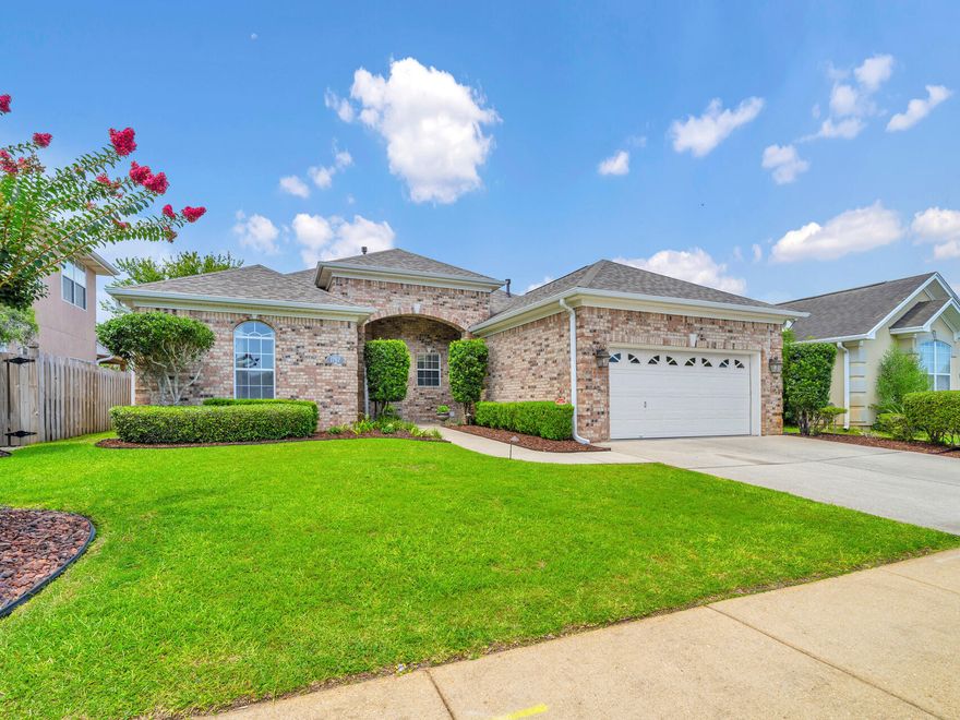 LOOKING FOR A SEPARATE, PRIVATE AREA FOR MOM, DAD OR OLDER KIDS? YOU'VE FOUND IT.  TIRED OF YARD WORK? LOOK NO MORE. Spacious studio w/kitchenette, new roof, large beautiful kitchen, small, low maintenance yard & community pool close by set this custom home apart.  Flowing effortlessly into the casual dining area & spacious living rm w/12 ft tray ceiling & gas fireplace, the NEW, giant, 42sf Quartz kitchen island takes center stage & will be the gathering place for all! A separate formal dining rm w/11 ft tray ceiling sets the stage for intimate gatherings & celebrations.  Work privately from home from the separate office w/11 ft tray ceiling & French doors. The large master w/11 ft tray ceiling adjoins the sprawling master bath w/luxurious custom tiled walk-in shower, soaking tub, his & her vanities w/make-up area & large walk-in closet.  The studio w/ensuite full bathroom,  kitchenette w/full size refrigerator, sink & microwave and large walk-in closet has plenty of space for a living, dining & bedroom area and is an ideal space for an elderly parent or older child. Other features include beautiful NEW LVP flooring in the office, master & 2nd bedrooms, NEW stove, NEW dishwasher, large laundry room, GAS heater, GAS HWH, large storage area in the garage, sprinkler system w/well & Generac full house generator.  Enjoy the Florida lifestyle and summer gatherings without the heat or sun relaxing on the large, screened porch w/wall AC unit. The modest sized yard with NEW 8 ft fence & small patio provides privacy and grassy area to enjoy the outdoors WITHOUT the hassles of a large, high maintenance yard.  Cool down on a hot day in the community pool just a block away. Located in the desirable gated community of Bridgeport Colony with UNDERGROUND UTILITIES, sidewalks & LOW $750/year HOA,  this beautiful custom built home is close to both bases, schools, shopping and restaurants.  