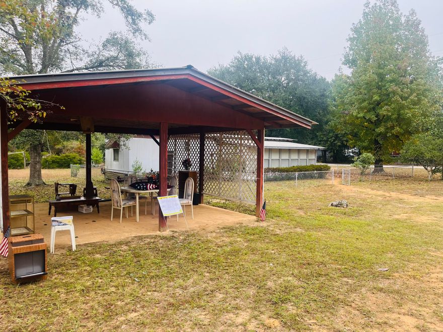 Discover a great opportunity in the Oakwood Hills subdivision. This 2-bedroom, 1-bath mobile home sits on just under half an acre, with a carport and a chain-link fence around both the home and property. The screened-in front porch offers a comfortable outdoor space, and the paved road access adds convenience.While the interior could use some updates, it remains livable and provides potential for an investor or buyer looking to add personal touches. The exterior is well-maintained, with attractive bushes and landscaping that enhance the property's curb appeal. Contact us to learn more about this property and its potential