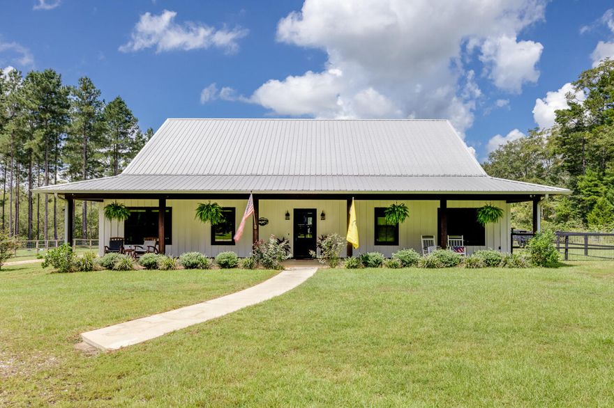Welcome to your private retreat nestled on 37 acres in Bonifay, Florida! This stunning property perfectly blends modern comfort with serene country living. Step inside and you'll find a home that is absolutely gorgeous--designed with care, natural light, and inviting spaces for both relaxing and entertaining.  Outside you will find the screen enclosed heated gunite pool and hot tub, grill/kitchen area, and a HUGE garage that will easily fit multiple vehicles and all of your toys! Surrounded by 37 private acres, you'll enjoy both the tranquility of nature and the beauty of a home that was custom built with top-tier choices. Whether you're looking for a full-time residence, a family retreat, or a hobby farm, this property checks every box. See Features sheet for a full list of highlights!