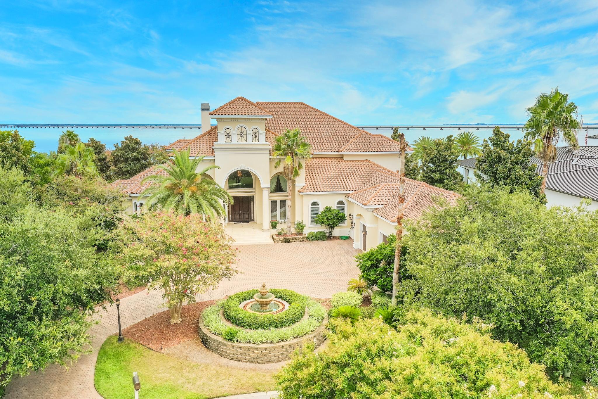 Opportunities like this do not come along very often! With 218 feet of Bay front views and perfectly positioned in the enclave of Waterford in Kelly Plantation, this exquisite Boswell Constructed Mediterranean home is the essence of perfection. 25 foot entry trey ceilings and Bay views from every major room add to the enchantment of this property. Large outdoor living areas include tanning deck, swimming pool, and steam shower only add to the immense list of features this home has to offer. This luxurious home offers a double gated community feature, and the elite distinctive association of being a resident of the Waterford Community located inside Kelly Plantation.