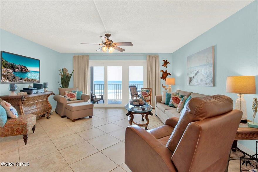 Welcome to your charming one-bedroom unit, nestled within the coveted, serene enclave of Mariner West, a low-density mid-rise condo development. Step into the inviting living space, where expansive windows frame breathtaking vistas of the Gulf of Mexico's pristine white sands and shimmering emerald waters. Delight in the unparalleled beauty of sunsets from your private balcony, serenaded by the gentle rhythm of waves lapping against the shore. Inside, discover a seamless blend of style and functionality, with tiled flooring enhancing the kitchen, living, and bathroom areas, while plush carpeting adorns the bedroom for cozy comfort. The kitchen is a culinary haven, boasting elegant granite countertops, a tasteful stone tile backsplash, rich cherry cabinets, and modern white appliances. Throughout the condo, a tranquil coastal blue palette creates an atmosphere of relaxation and serenity. Indulge in luxury within the master bathroom, featuring a tiled shower enclosed by sleek glass doors, complemented by granite vanities in both bathrooms. Outside, Mariner West offers resort-style