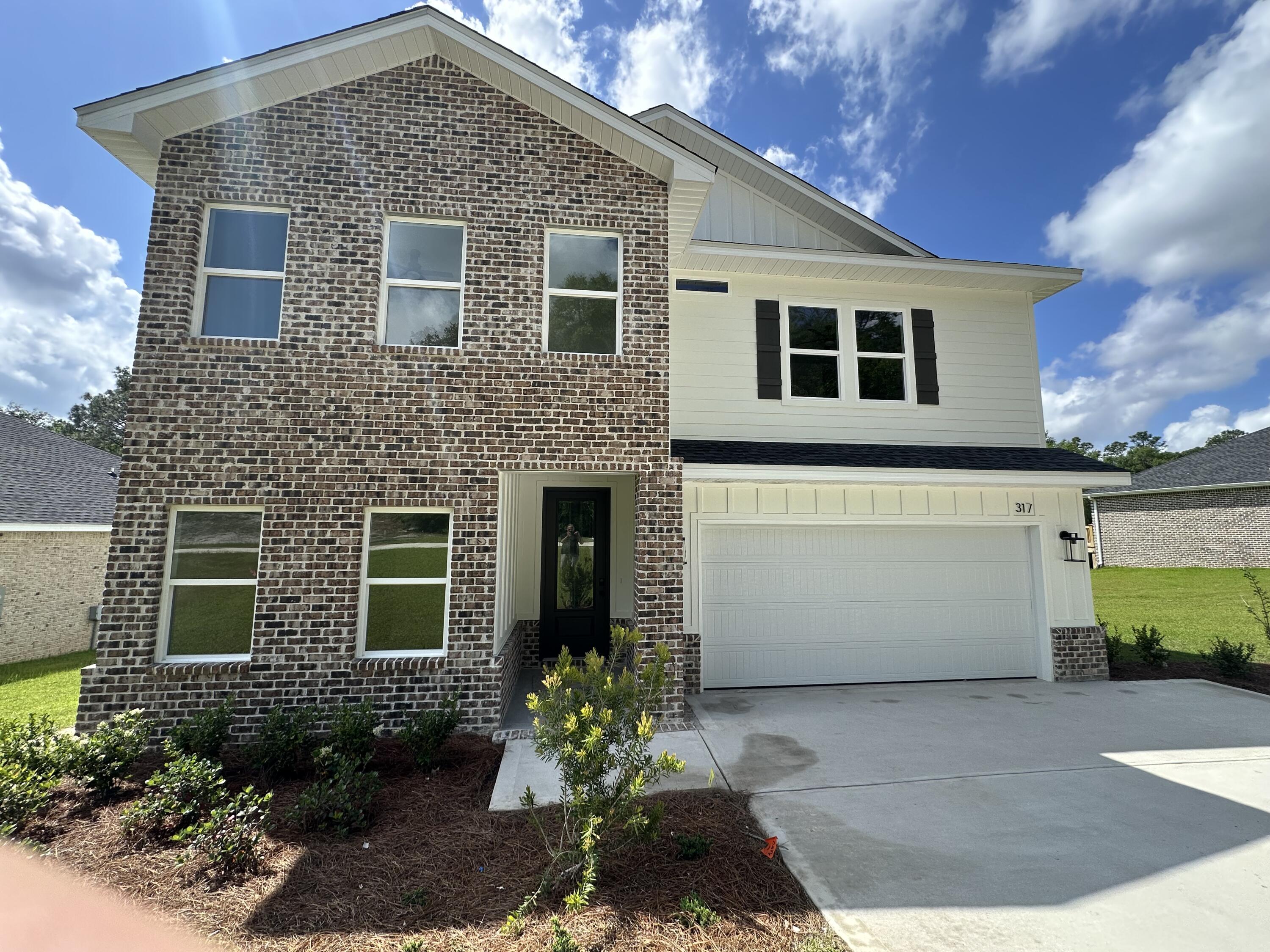 Completed New Home in South Crestview on a Spacious Wooded Homesite!This newly finished brick-and-Hardie exterior home features 5 bedrooms and 3 full baths, offering a thoughtfully designed open floor plan ideal for gatherings and everyday living. The layout maximizes space and natural flow from room to room. Highlights include a Tankless Rinnai water heater and quality finishes throughout. Conveniently located on the desirable south end of Crestview, with easy access to major roadways including Hwy 85 and I-10. Nearby you'll find shopping, medical facilities, dining options, and more in the growing Crestview Commons area. Customizable kitchen backsplashes tailored to buyers' preferred selections.
