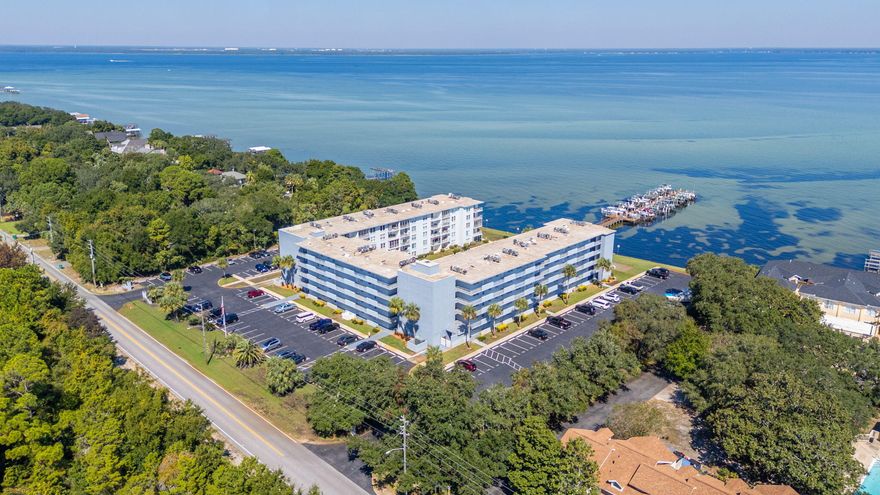 Experience waterfront living at its finest in this fully remodeled 2-bedroom, 2-bath condo on the beautiful Choctawhatchee Bay--complete with your own private boat slip. Just steps from your door, enjoy access to a large clubhouse and a bayfront pool, perfect for relaxing or entertaining. The dock offers even more with a fishing bench, picnic areas, and so much more to enhance your coastal lifestyle. Inside, every detail has been thoughtfully updated, including a modern kitchen with elegant white cabinetry, quartz countertops, and built-in appliances that are only three years old. Both bathrooms feature new tile shower surrounds, stylish vanities, and updated fixtures. New flooring runs throughout, highlighted by an upgraded porcelain tile herringbone pattern in the kitchen, and new recessed lighting adds a bright, welcoming feel. With an HVAC system less than four years old, this move-in-ready condo offers comfort, style, and unbeatable access to the bay.

*Note- Seller is willing to add a stackable laundry inside the unit with an acceptable offer. 