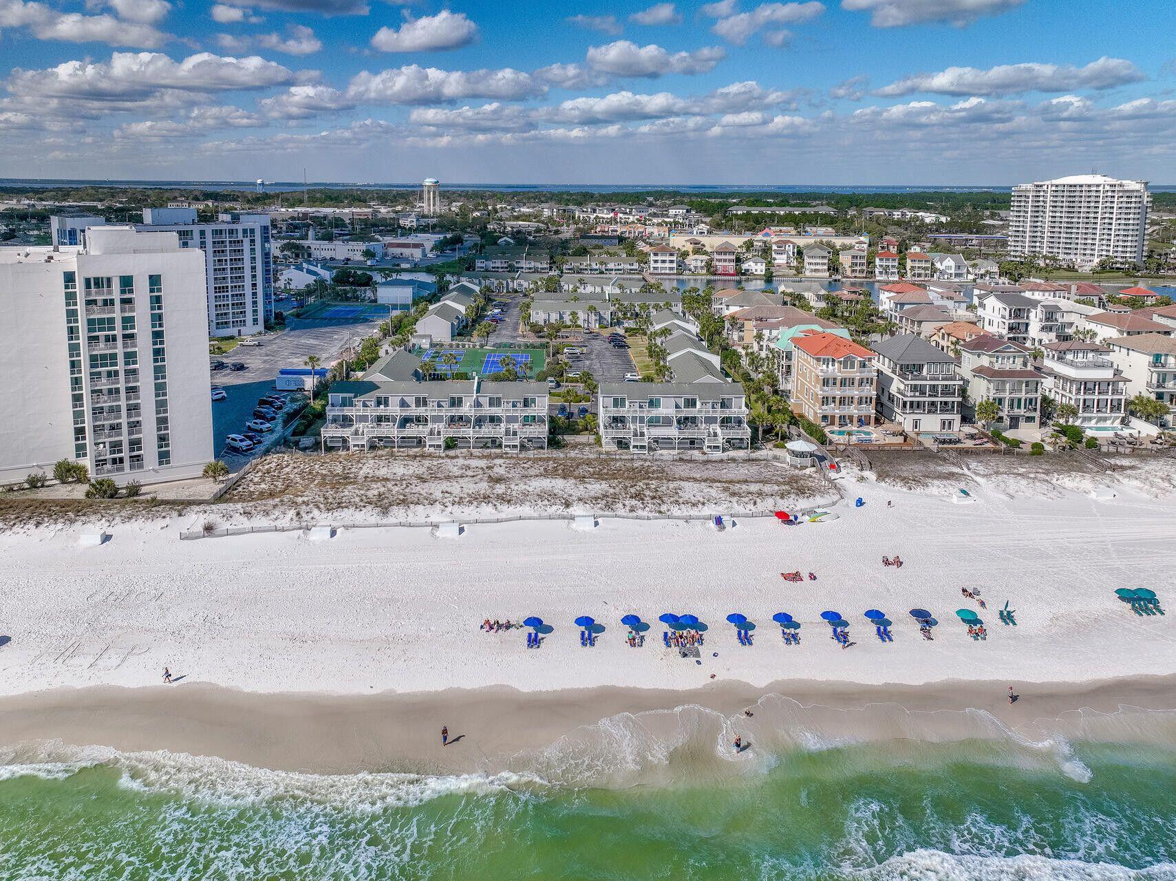 Introducing an unparalleled opportunity to own a completely remodeled luxury condo in Destin, with deeded beach access and close proximity to golf, fishing, and area attractions. This meticulously transformed unit boasts floor-to-ceiling renovations, offering an exquisite blend of sophistication and modern design. The kitchen has been transformed and reimagined with custom cabinetry, stunning quartz countertops, and bespoke shelving--perfect for the discerning chef. Throughout the condo, you'll find rich wood floors, new baseboards, and luxurious finishes, with every interior door, door frame, and furniture piece replaced for ultimate elegance. Every inch of this condo exudes refinement, from the freshly painted walls to the brand-new washer/dryer and water heater. More.... Top-of-the-line dishwasher, new front and storm doors, outdoor lighting, and modern sliding laundry doors. The condo has also been upgraded with state-of-the-art insulation, including blown open-cell foam and sealed vents, along with a complete air duct replacement to optimize airflow. The circuit breaker panel was upgraded to ensuring reliable power. Step outside to a lifted concrete patio with a new roof over the rear storage area - perfect for outdoor enjoyment.
This home is not just a living space but a sanctuary, designed for the most refined tastes and built to last with unparalleled quality and attention to detail. Enjoy the convenience of a designated parking space right outside your front door, with additional overflow parking available for guests. As a member of the desirable Southbay community, you'll have access to an array of recreational activities, including lighted tennis courts, shuffleboard, fishing, and community BBQ grills. Two sparkling full-size pools, each with a kiddie pool, provide the perfect place to relax and cool off. The crown jewel of Southbay is its 300 feet of private, deeded white sand beach access, just a short stroll across a picturesque lake bridge. Whether you're seeking an active lifestyle or simply want to unwind by the water, this community has it all. With retail shops, dining options, and attractions like Big Kahuna's Water & Adventure Park nearby, this location truly offers the best of everything. The time to invest is now don't miss your chance to own this one-of-a-kind coastal retreat.