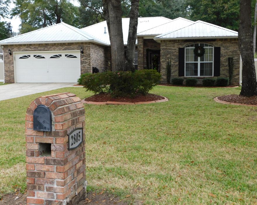 Experience affordable Florida living, in the desirable location of Southeast Crestview. Sitting in a quiet Culde-De-Sac, this beautiful home greets you with a manicured landscaping and a raised solid column front porch. Upon entering, you will notice a large open space with formal dining and great room; cutting edge espresso bamboo flooring throughout, except for wet areas. Vaulted ceiling and a gas fireplace, enhancing the great room. Some of the amenities found in the kitchen are: Cathedral ceiling, Quartz counter tops, crystal stone backsplash; 42'' upper cabinets, gas stove, spacious pantry, large island, informal dining, and large window that overlooks the relaxing screened pool. This split floor plan placed the Master bedroom at the opposite side of the other 3 bedrooms.