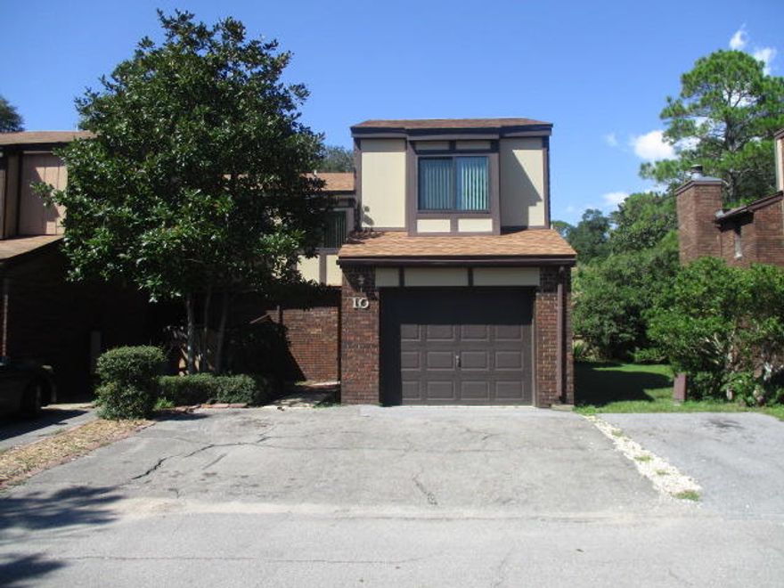 This spacious townhome is located in the heart of valparaiso, just outside the back gates of Eglin AFB. The Kitchen is bright and cheery with breakfast bar and is open to all living areas downstairs. Tile Flooring downstairs and carpet in all upstairs bedrooms. Wood burning fireplace in livingroom ,laundry hookups in garage, balcony off master BR and fenced rear patio area with gate. The bathrooms have been updated including flooring, tubs, sinks and vanities. Extra Parking spaces in front of unit plus garage. Hidden Cove is a waterfront community offering residents a pool,exercise room & dock for daily swimming fishing or enjoying the sunrises and sunsets. Boat docking is an extra fee and would be subject to association approval. Call to make an appt today.
