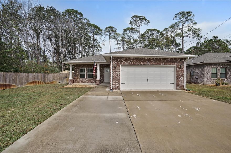 All brick home 4 miles from Hurlburt Field Gate. READY FOR MOVE IN NOW! Open concept floor plan w/ 10' heights in the main living area, 9' ceilings in remaining rooms. Tray ceilings in living room and master bedroom. Luxury vinyl plank flooring throughout w/ plush carpeting in bedrooms. Kitchen and bath have ALL WOOD ''shaker style'' cabinetry w/ soft close doors. 10' Center island w/ LED pendant lighting, and granite counter-tops. Kenmore stainless appliances w/ side-by-side refrigerator and large pantry. Large crown molding in main living area, kitchen, dining, and master bedroom. Covered rear entry porch and fenced yard with gates. Large fully landscaped lawn w/ sprinkler system. Washer and dryer are staying with the home, they are 3 months old. Did we mention the hot tub and gutters?