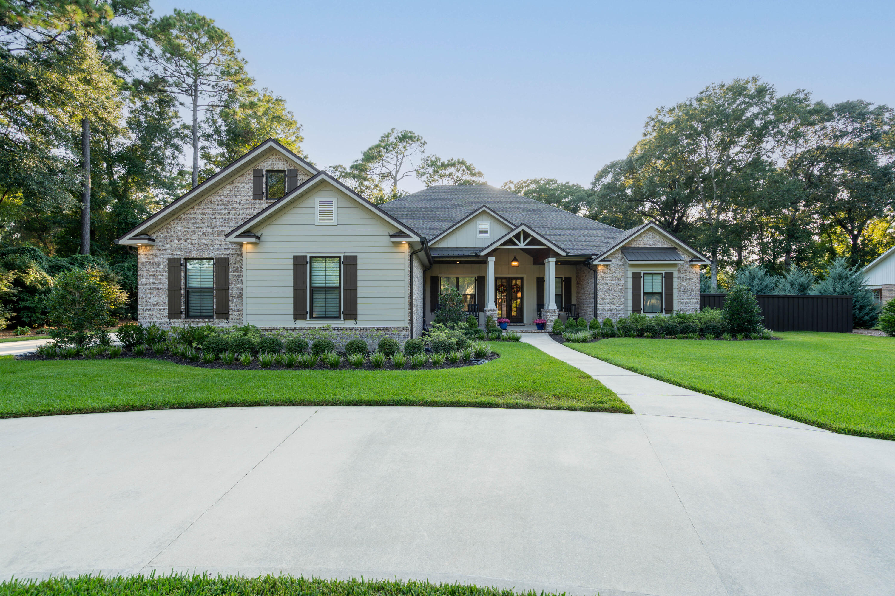 Welcome to Your Dream Home in Linene WoodsImmerse yourself in the perfect fusion of modern elegance and timeless craftsmanship with this custom-built estate in the Linene Woods community of North Crestview. Set on a sprawling 0.62-acre lot, this 3,004-square-foot home redefines luxury living with impeccable design and attention to detail.As you approach, the home's commanding presence is undeniable. A stately front porch, elegant circular driveway, and an oversized three-car garage offering over 900 square feet create an impressive first impression. Inside, 10-foot ceilings and oversized windows flood the home with natural light, while exquisite details like cased windows, crown molding, and custom trim work set a tone of refined sophistication. The home's open-concept layout balances style and functionality, offering four spacious bedrooms and a versatile office/flex room to adapt to your lifestyle. The living and dining areas feature dramatic interior brick columns, a striking brick fireplace, and custom wood beams that add warmth and character. Built-in cabinetry provides charm and practicality throughout.

At the heart of the home is the chef's kitchen, a masterpiece of design and utility. Quartz countertops, an oversized island with storage, and floor-to-ceiling custom cabinetry are paired with premium touches such as a herringbone subway tile backsplash, a pot filler, and high-end appliances. This space isn't just for cooking; it's a place to create and entertain.
The primary suite is a haven of tranquility, with a custom trey ceiling featuring a stained cypress inlay and French doors opening to the serene backyard. The spa-like en-suite bathroom is a masterpiece, offering dual vanities, a freestanding soaking tub, and a fully tiled walk-in shower with dual showerheads and body sprays. A custom-designed walk-in closet with built-in shelving and a central island ensures every item has its place.

The outdoor space is nothing short of extraordinary. A resort-style backyard invites you to relax and entertain in style. The expansive covered porch, complete with a stacked stone fireplace and cypress ceilings, overlooks a sparkling pool and a fully equipped outdoor kitchen featuring a Blaze refrigerator and natural gas grill.

For added peace of mind, a 22kW Generac generator ensures uninterrupted comfort, no matter the season.

This one-of-a-kind home offers a seamless blend of elegance, functionality, and Southern charm. Every detail has been thoughtfully crafted, making it the ultimate retreat for discerning buyers. Welcome to the life you've always dreamed ofwelcome home.