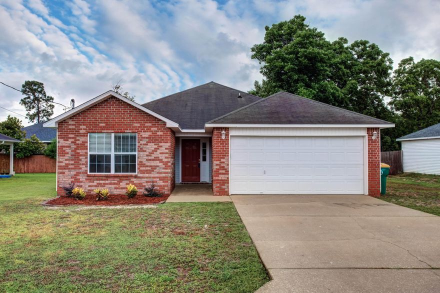 CONVENIENT TO HURLBURT! This gorgeous home features an open floor plan, tray ceilings, tile floors, and brand new carpet! The master suite has double vanities, separate shower, and a large walk in closet. The fenced back yard has a covered patio, shed, and fire pit. Schedule your viewing today. Don't wait as it will not last!