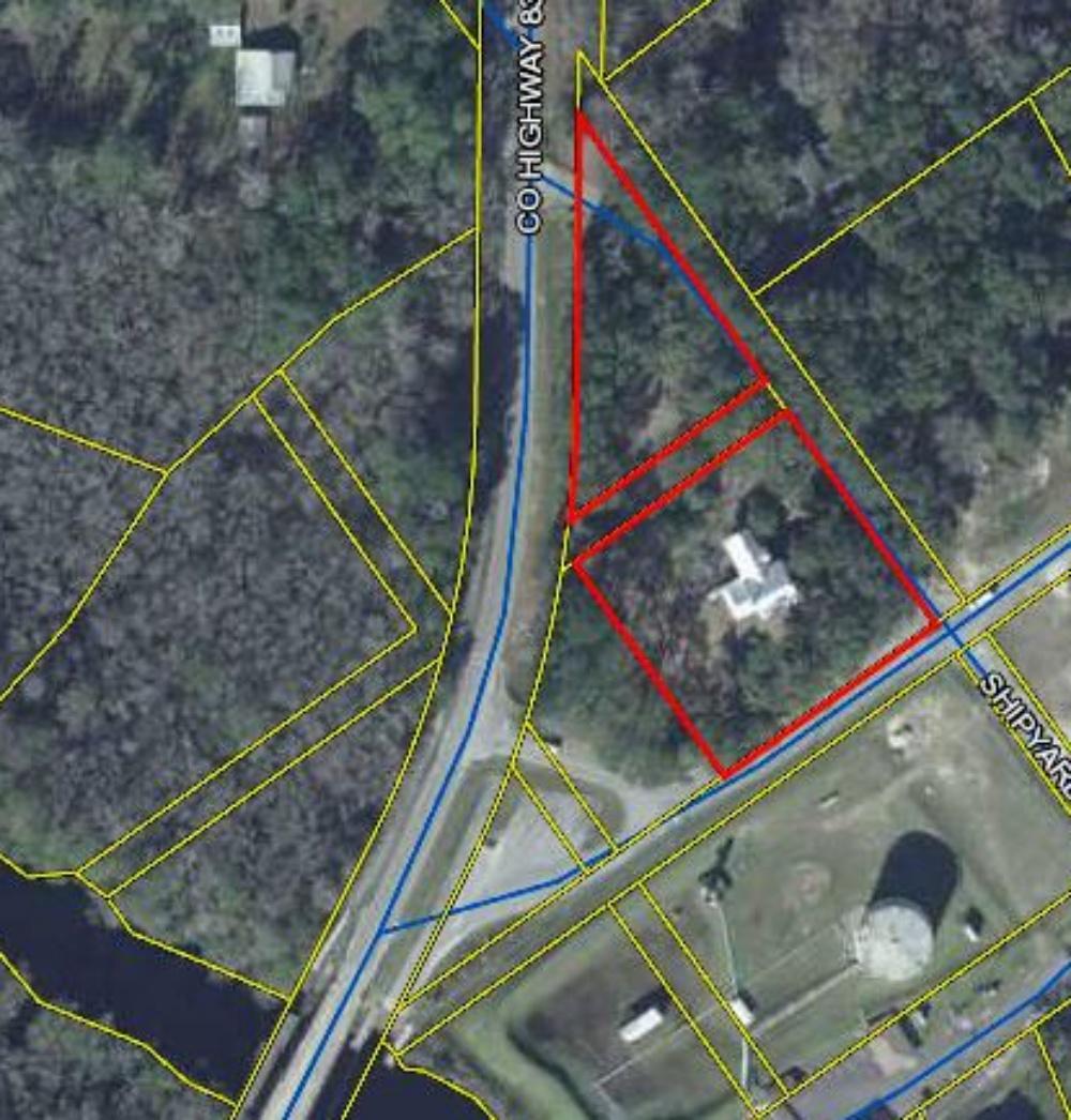 2.21 acre property zoned 'I-2' Industrial, located in the port area business district in Old Freeport directly across from the public boat launch on Four Mile Creek. This property also features Historic (1889) 1900's McCaskill home. Seller says home has been connected to sewer and public water, and completely rewired along with being upgraded to a 200 amp service, New (2016) HVAC includes two 2 ton units for the first floor and two 2 ton units for the upstairs. The roof was replaced in 2015. Structures on the property will convey in current 'as is' condition.