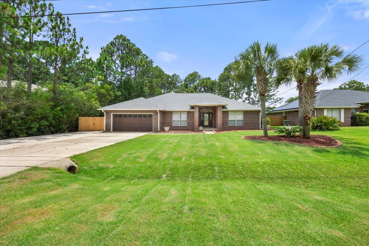 Welcome to this beautiful all-brick contemporary home located in desirable Holley By the Sea community. This spacious 3-bedroom 2-bath residence sits on nearly half an acre and offers over 2200 sq ft of comfortable stylish living space-plus an additional 191 sq ft screened in Florida room overlooking a large, shaded back yard. Inside you'll find luxury vinyl plank flooring throughout the main living areas. A 20x16 primary suite with private access to the sunroom and en-suite bath featuring a garden soaking tub,separate shower, double vanities, and two oversized walk-in closets. The kitchen has stainless steel appliances, modern backsplash, granite countertops and a large single bowl sink. Beside the kitchen is a dedicated office space ideal for remote work or a flex room. The front of the home features an extended driveway with double gate access perfect for boat storage. Major updates to the home include 2021 roof, HVAC and water heater for peace of mind.
Living in Holley By the Sea means you also gain access to the top-notch recreation center, including 3 pools, a fitness center, tennis courts, a fishing pier and private boat launch.
Don't miss this opportunity to own a move-in ready home with space, updates and unbeatable amenities.