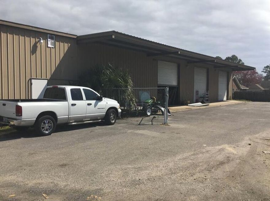 7168 SF warehouse with loading dock, 3 rollup doors, with small office space , sits on .48 acre parcel right off of Green Acres Road in Fort Walton Beach FL, minutes from back gate of Hurlburt AFB and front gate of Eglin AFB, owner occupied, great location and conveniently located