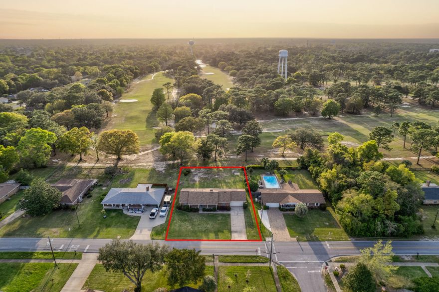 Welcome to this charming home nestled right on hole 8 of the Fort Walton Beach Golf Course. Boasting timeless appeal and a prime location, this residence offers a perfect blend of classic elegance and modern convenience. This well-maintained home spans 1860 square feet and features three spacious bedrooms and two full bathrooms. The roof was replaced in 2019, and the HVAC is only 1 year old! The heart of the home centers around a brick, wood burning fireplace, as well as sliding glass doors that access the backyard. This creates an ideal setting for intimate gatherings and enjoying the gorgeous Florida weather. For those who appreciate culinary endeavors, the kitchen offers ample space and functionality, with a large breakfast bar, as well as a breakfast nook. In the front of the home,