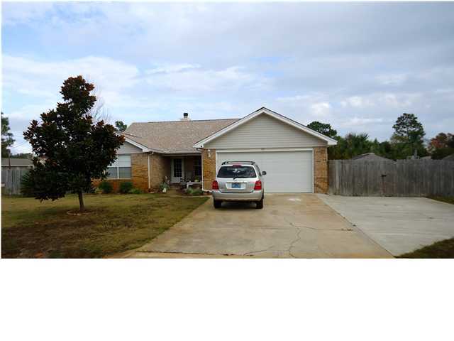 More for your comfort, convenience and money, this all electric home sits on a large corner lot just minutes away from Hurlburt, beaches and shopping. Many updates include new roof in 2004, updated wall to wall carpeting, tile floors in kitchen and baths, smooth top range, and new counter tops. Livingroom has woodburning fireplace, vaulted ceiling and is prewired for surround sound. Sprinkler system and lawn pump on automatic timer. Large, inviting ozone pool in a beautifully landscaped back yard for entertaining or relaxation, and a separate, fenced-in area to park your boat or RV.