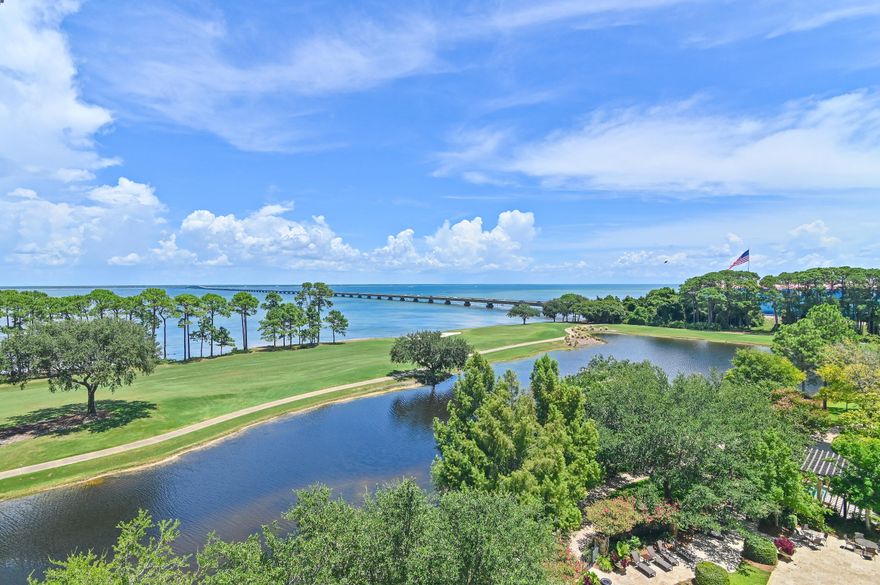 Prepare to be surprised:  this home looks beautiful in photos, but it's breathtaking in person!!  Luxuriously redefined in 2021, this 3,008 sq ft One Water Place residence features a highly desired open-concept layout designed to capture natural light and frame the sweeping views of the Bay, golf course, lakes, fountains and pool.  Wake up to stunning sunrise light and an ever-changing water-and-coastline panorama.  The redesigned kitchen offers custom cabinetry, a 12' x 14' quartz waterfall island, Thermador appliance suite with induction, plus a custom wet bar.  Raised ceilings, a lighted two-sided linear gas fireplace, Lutron lighting, California closets and marble-appointed baths with spa-like primary suite featuring steam shower complete the elevated coastal feel. Step off the elevator into an airy, open living environment framed by beautiful custom glass doors and carefully crafted finishes.  Walls and columns were removed and ceilings raised to enhance flow and natural light.  New flooring extends throughout the home and both balconies, with marble surfaces in the bathrooms and showers.  The Thermador package includes speed oven/microwave, wall oven, dishwasher, beverage center and ice maker for effortless entertaining.  A Lutron  lighting system, LED upgrades and motorized programmable Hunter Douglas window treatments add comfort and convenience.  Both balconies have been upgraded with modern tile and an outdoor summer kitchen setup with a Blaze gas grill and 2-drawer refrigerator.  An additional garage level storage space (approx 12' x 14') conveys.