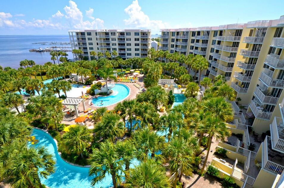 Rarely Available unit in the only Bay to Beach resort on the panhandle, which boasts a direct view of the bay. The covered balcony overlooks the award winning lazy river, lagoon pool, large heated pool, 2 hot spas, and lush landscaping. What to head to the beach? The sky bridge connecting to the gulf side of the resort is just steps away, and offers FOUR MILES of secluded beach eastword to the Destin Pass. This Great location is walking distance to the Boardwalk and its , restaurants, night clubs, shops and stores. There is not a better location to meet the whole family's needs.