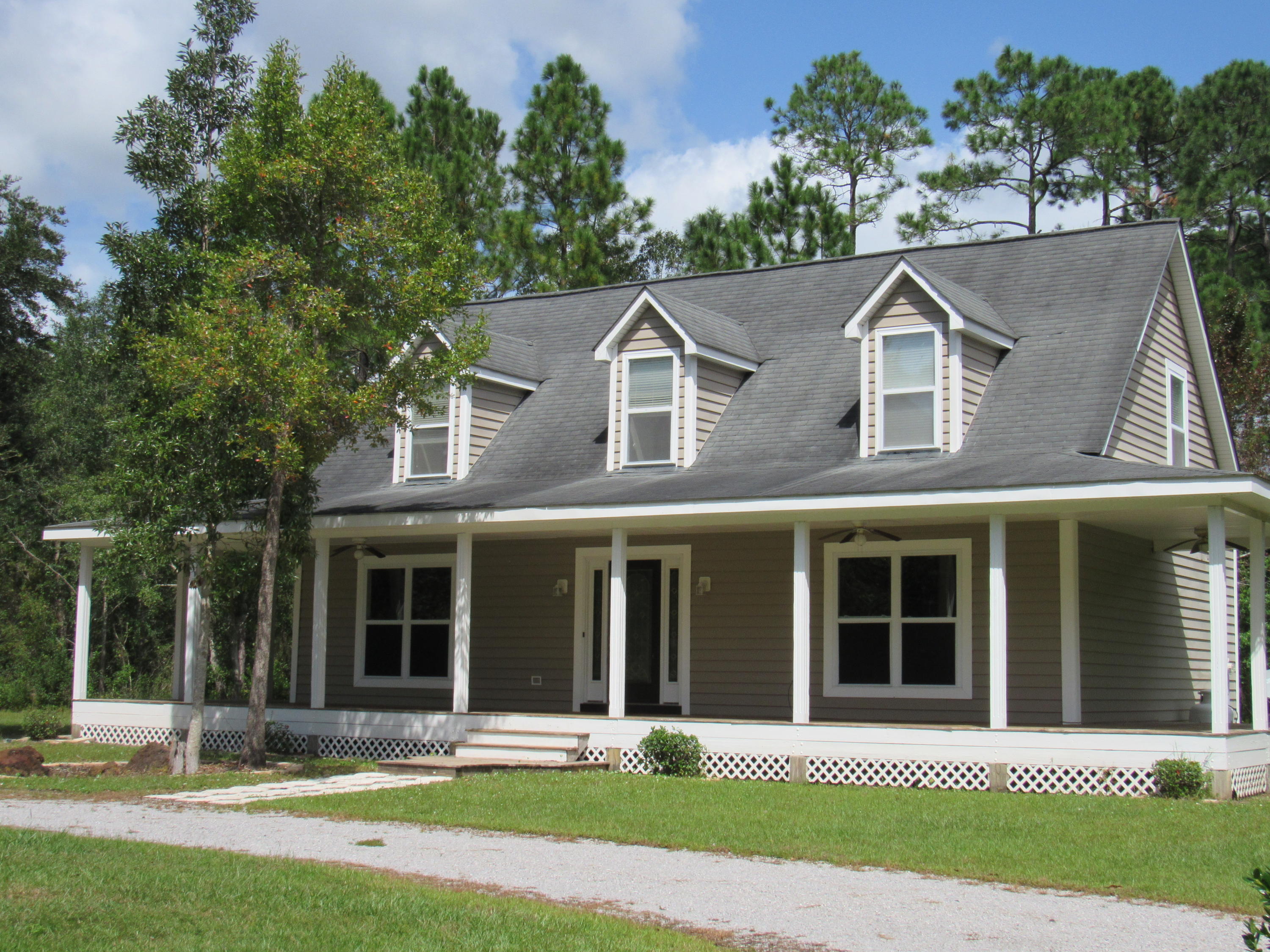 Beautiful southern living style home in Freeport with NO HOA! Are you ready to own a beautiful home and have the ability to to park your boat or RV in the yard without getting a citation from the HOA? Then look no further! This beautiful two story home features a large living room with gas log fireplace, beautiful open kitchen/dining/living area, first floor master, large master bath with separate vanity, beautiful kitchen granite countertops, gas stove, large laundry room, oversized upstairs bedrooms and 2nd floor living room. The home has a large wrap around porch and is situated on an oversized corner lot that is over 3/4 of an acre! Beautiful yard space with landscaping in place and circular driveway! This home won't last long! Bring offers! Call for your tour today!