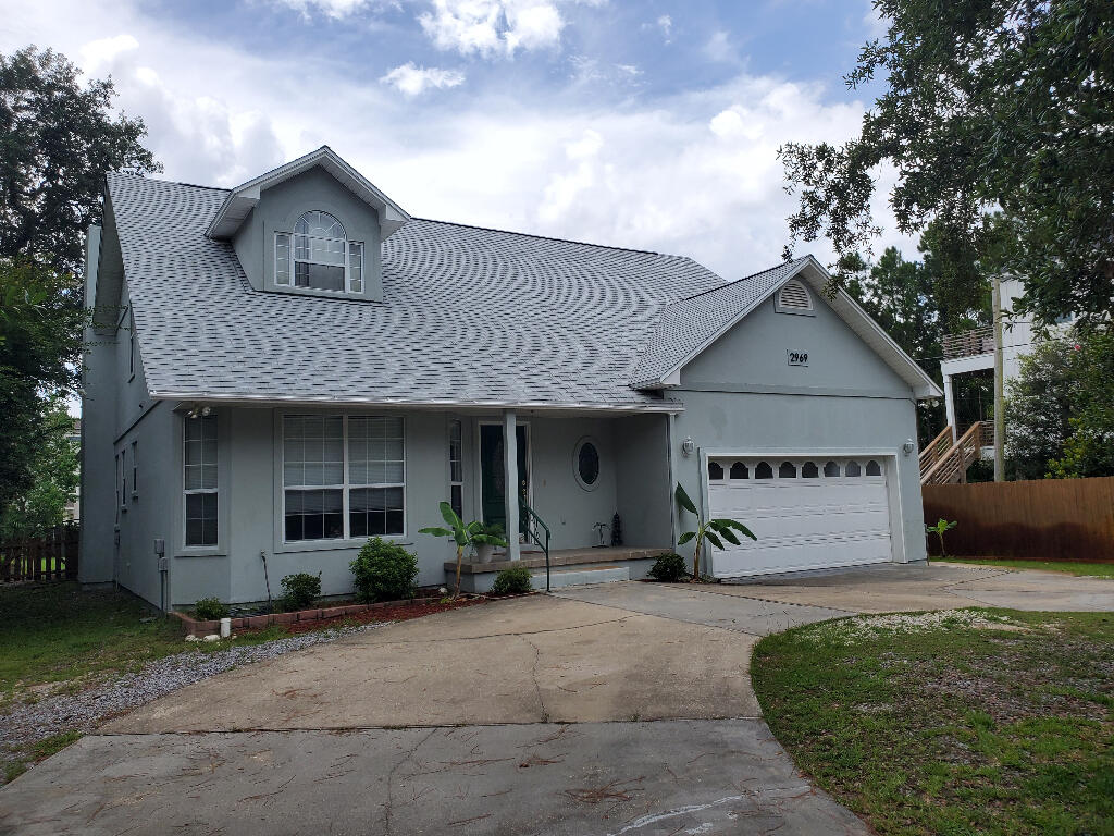 Beautiful, family home for sale in Gulf Breeze with a great location! Step into this well maintained, 3 bedroom 2 and a half bathroom house and you will know that your are HOME. From the welcoming circular drive to the Sound breezes in your back yard, this is the place for you. Two story charmer just minutes from Oriole Beach Elementary. You can see the Sound from your back yard! Large master bedroom suite that exits to the back yard and has a huge walk-in closet with attached master bathroom. Brand new roof! Engineered wood floors throughout the main living area. Vaulted ceilings in the living room and a gas, marble fireplace! The Hunter sprinkler system in the yard has it's own irrigation pump and so you save money on water. Upstairs you will find 2 bedrooms, 1 bath, and a walk-in atti