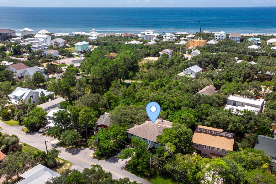 Great investment opportunity in Beach Highlands on 30a's west end! Home is situated on a nice private lot with plenty of room for a pool! You can walk to the beach and enjoy no HOA fees. This home needs work and is priced accordingly. The home is on pilings with a 19x11 workroom on the ground level. The main living area and the 3 bedrooms and 2 baths are located on 2nd level, with possible gulf views if you chose to add on a 3rd level! The home currently has stone floors, solid pine walls and beams in the living area, a brick fireplace, walk-in pantry, and large bar area.