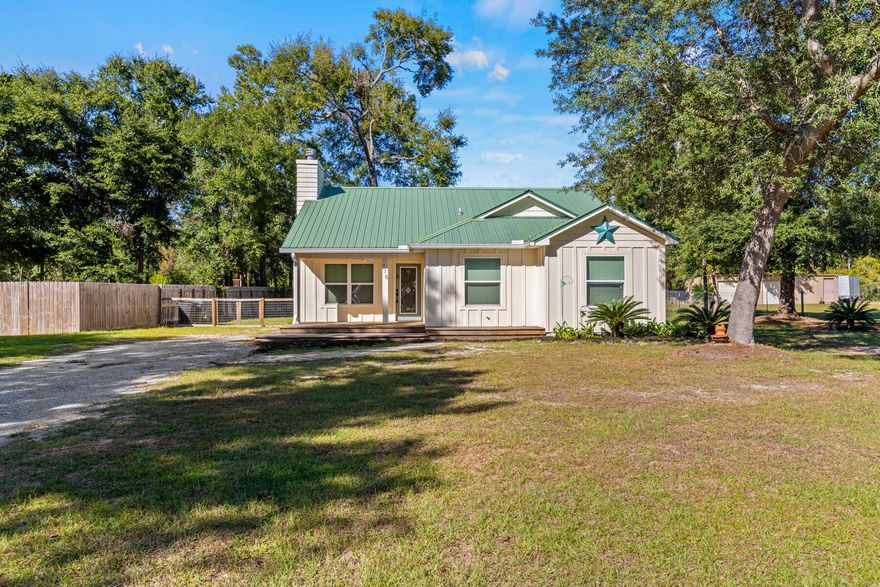 3 bed 2 bath Florida cottage situated on approximately one half acre with a great location in the rapidly growing Freeport area. Located off Hwy 331, this home is close to shopping in Freeport and only about 15 minutes from the beach, and literally a 1 minute drive to the Publix, shopping and more. The home features include a wood-burning fireplace and vaulted ceiling in the living area, ceramic tile floors in living room, kitchen, dining and bathrooms, also new flooring in bedrooms. This home has a nice split floor plan with the master bedroom and bath located at the rear of the home overlooking a wooded area. Glass sliders in the main living area let in lots of light and open onto a brick paver patio! Lots of space in the backyard and front yard for family and friends.
