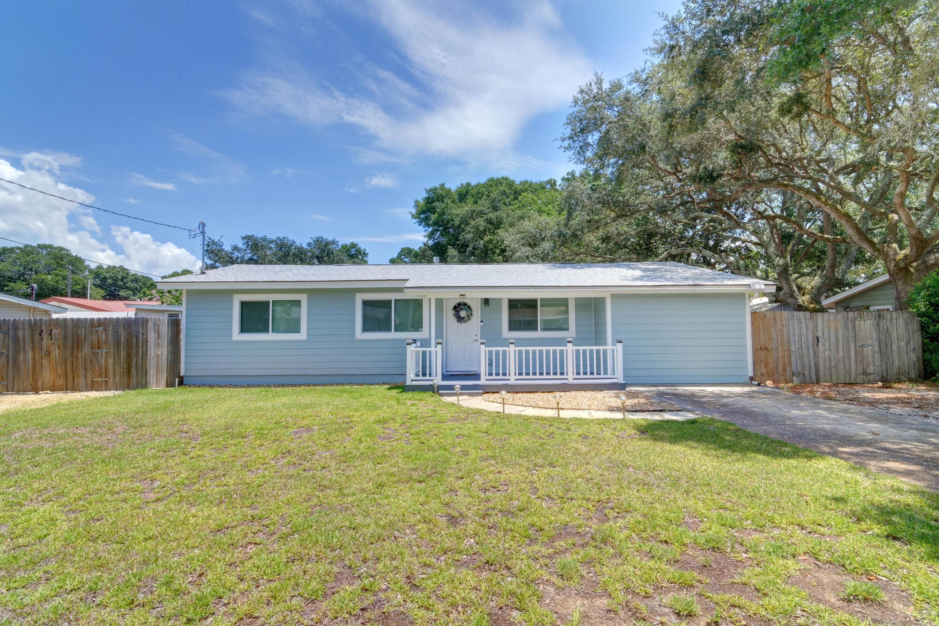 Looking for an adorable, fully updated, and affordable 4 bedroom 2 bath home on a fantastic lot close to Hurlburt Field? Look no further, this move in ready gem is ready for a new owner! From top to bottom you'll find a long list of home updates and fantastic features making this home better than new, and you'll have peace of mind with a brand new roof, new plumbing (including a new water heater), new HVAC with new ductwork, new windows, and updated wiring. Walk in the front door and appreciate the luxury vinyl plank throughout, and you will absolutely love the stunning kitchen featuring granite counters, beautiful glass tile backsplash, stainless GE Adora appliances including a convection oven, shaker cabinets and separate eat in kitchen space. Enjoy tasteful painting and updating
